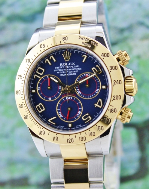 A ROLEX OYSTER 18K YELLOW GOLD AND STEEL DAYTONA COSMOGRAPH - 116523